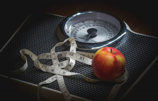 Weight loss - scale, measure tape, apple